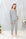 Model wearing Jolene Long Pajama Set in heather gray with white piping and tapered ankle-length pants