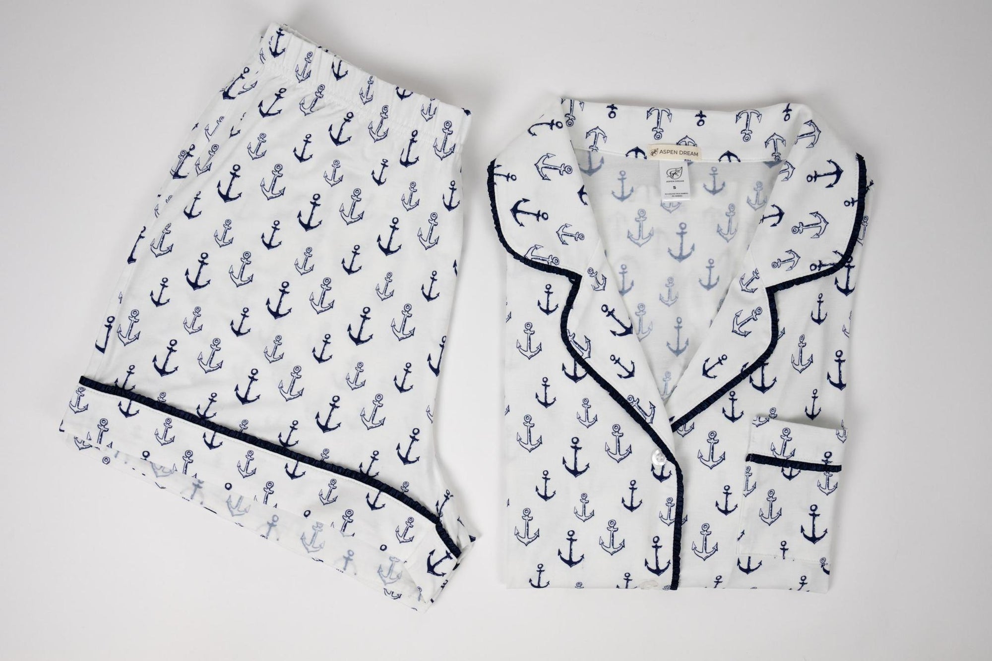 Flat lay of the Jolene Short Pajama Set in Anchor Print with piped button-down top and matching shorts