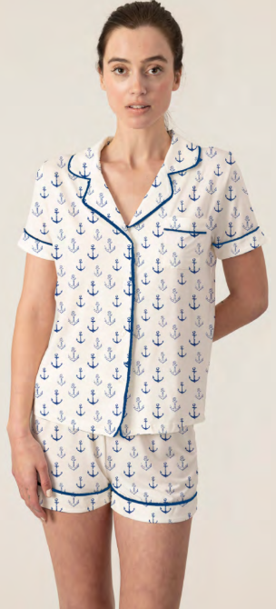 Model wearing Jolene Short Pajama Set in ivory with navy anchor print, short-sleeve button-down top, and mid-rise shorts