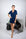 Model wearing Jolene Short Pajama Set in navy with ruffled piping and a short-sleeve button-down top.