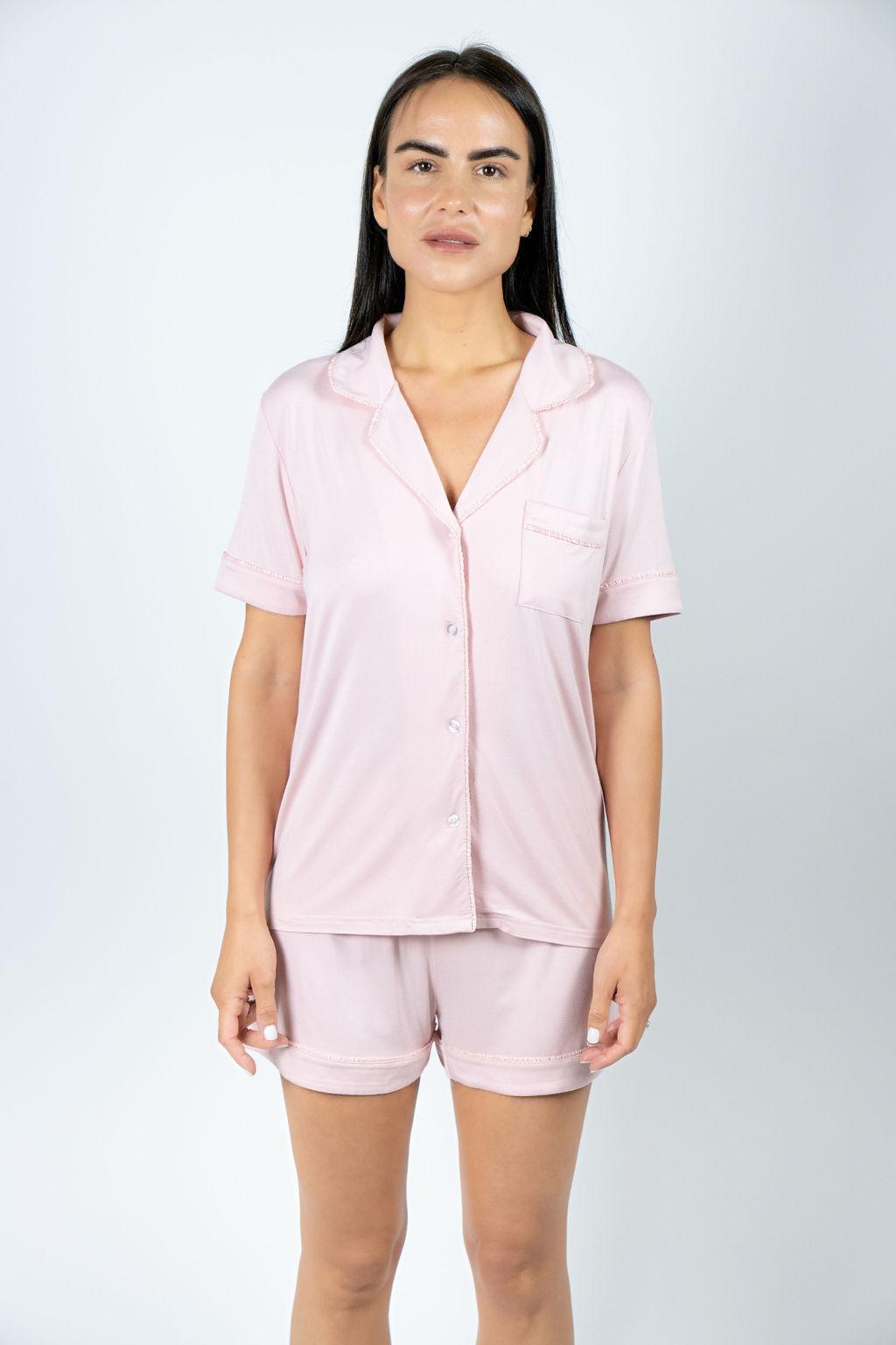 Model wearing the Jolene Short Pajama Set in rose powder with short sleeves and mid-rise shorts