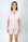 Model wearing the Jolene Short Pajama Set in rose powder with short sleeves and mid-rise shorts