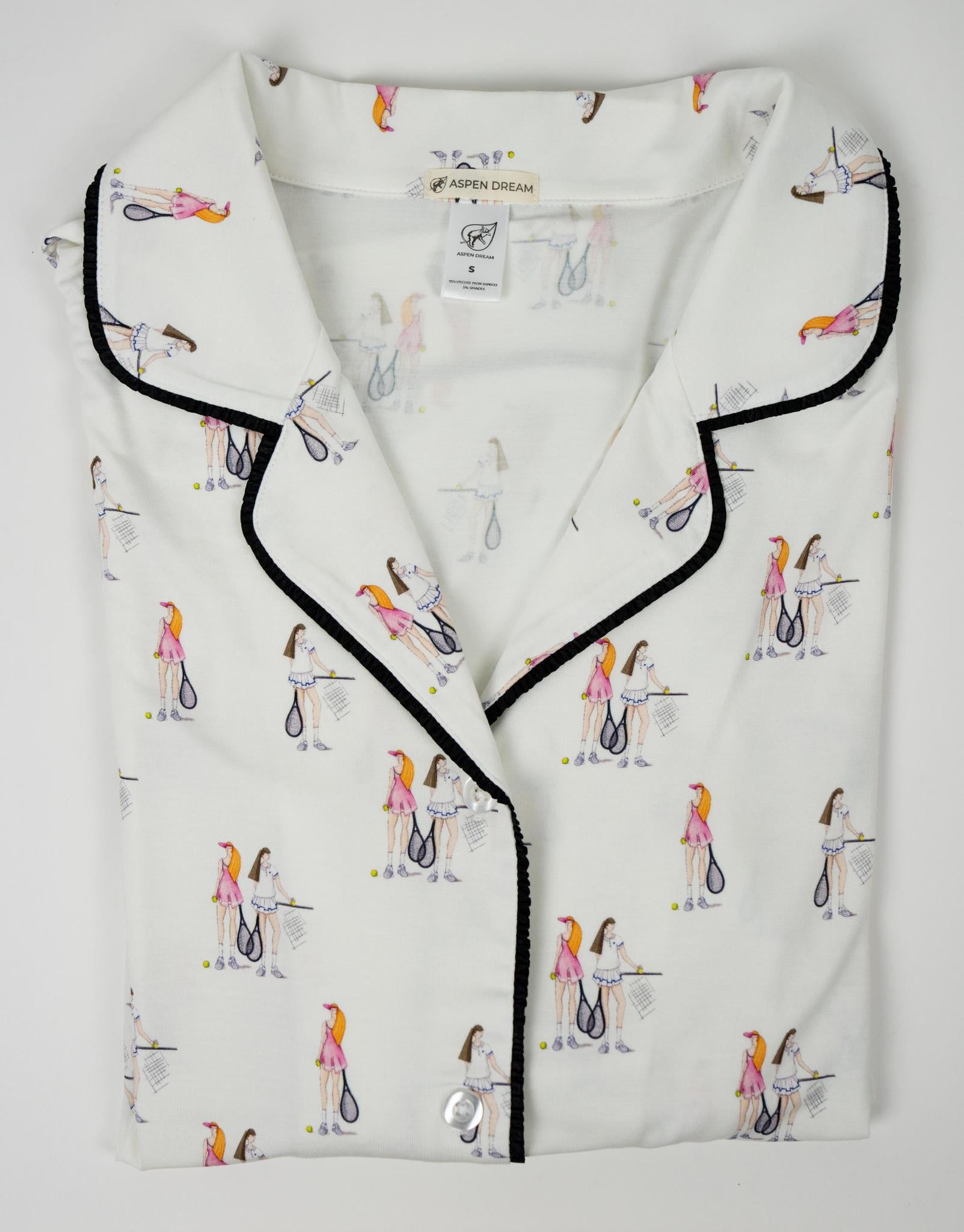 Flat lay of the Jolene piped short-sleeve pajama top in tennis print