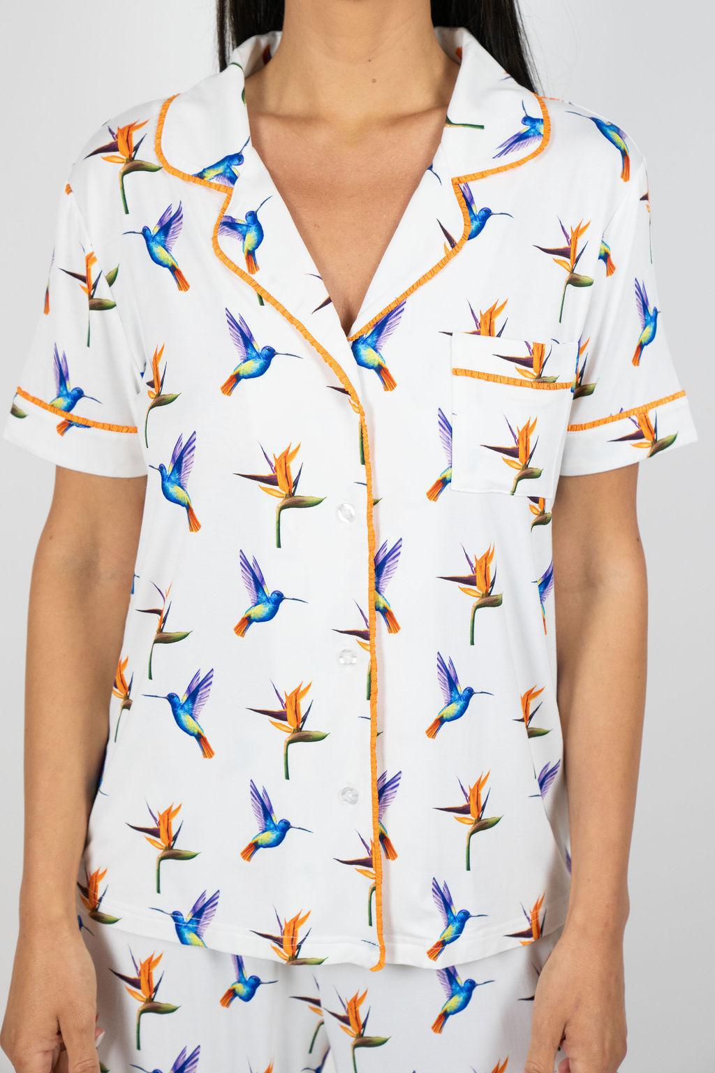 Close-up of hand-drawn hummingbird print on the Jolene pajama top with contrast piping