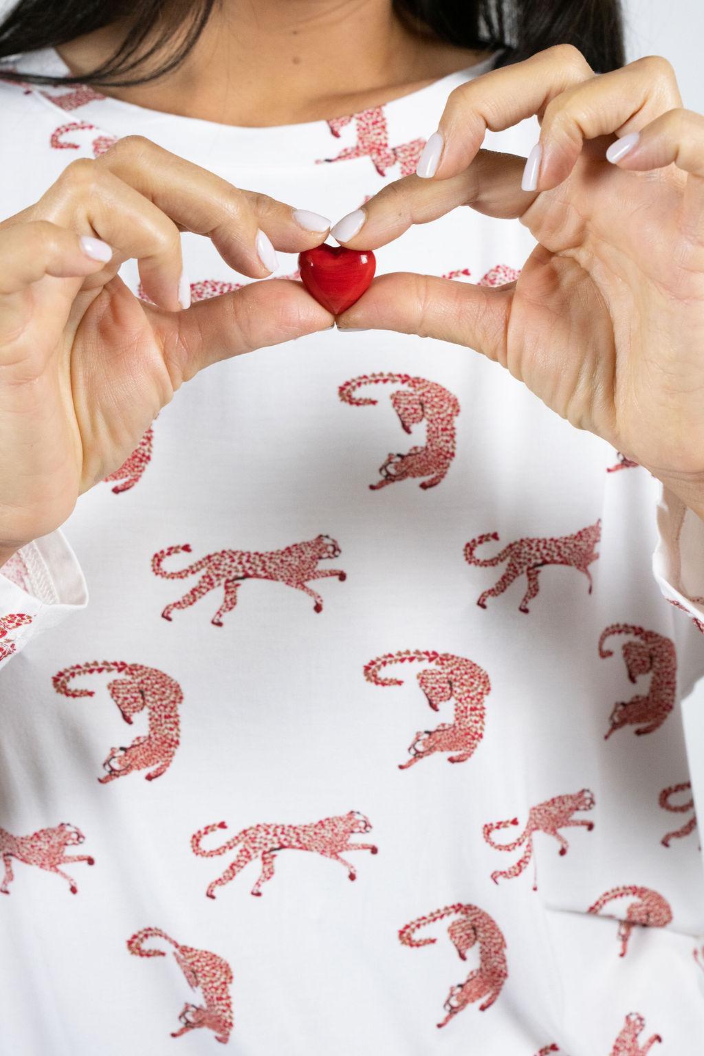 Close-up of playful cheetah hearts print on the Loose Lounge Set’s top.