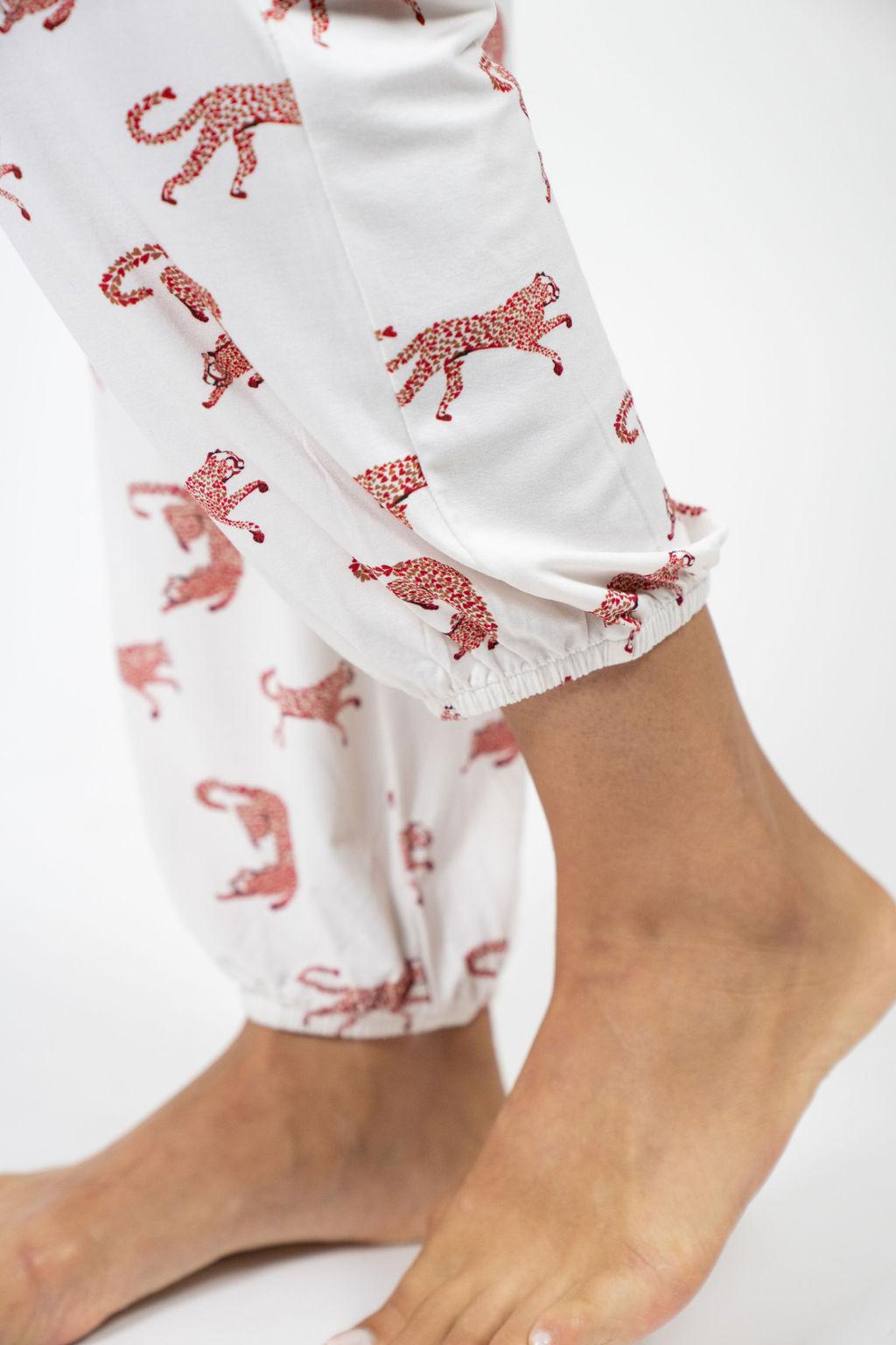 Close-up of playful cheetah hearts elastic band on the Loose Lounge Set's pants