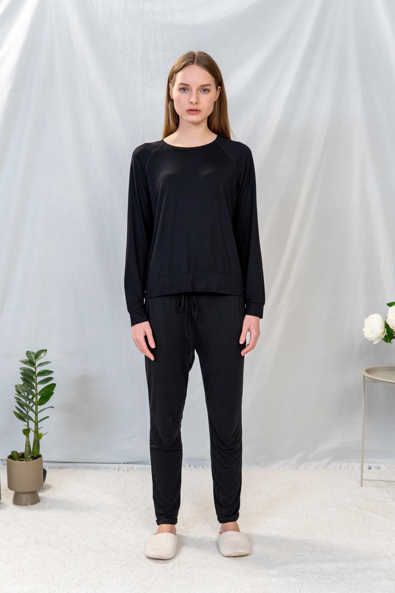 Model wearing Black lounge long set with raglan long-sleeve top and cuffed drawstring pants