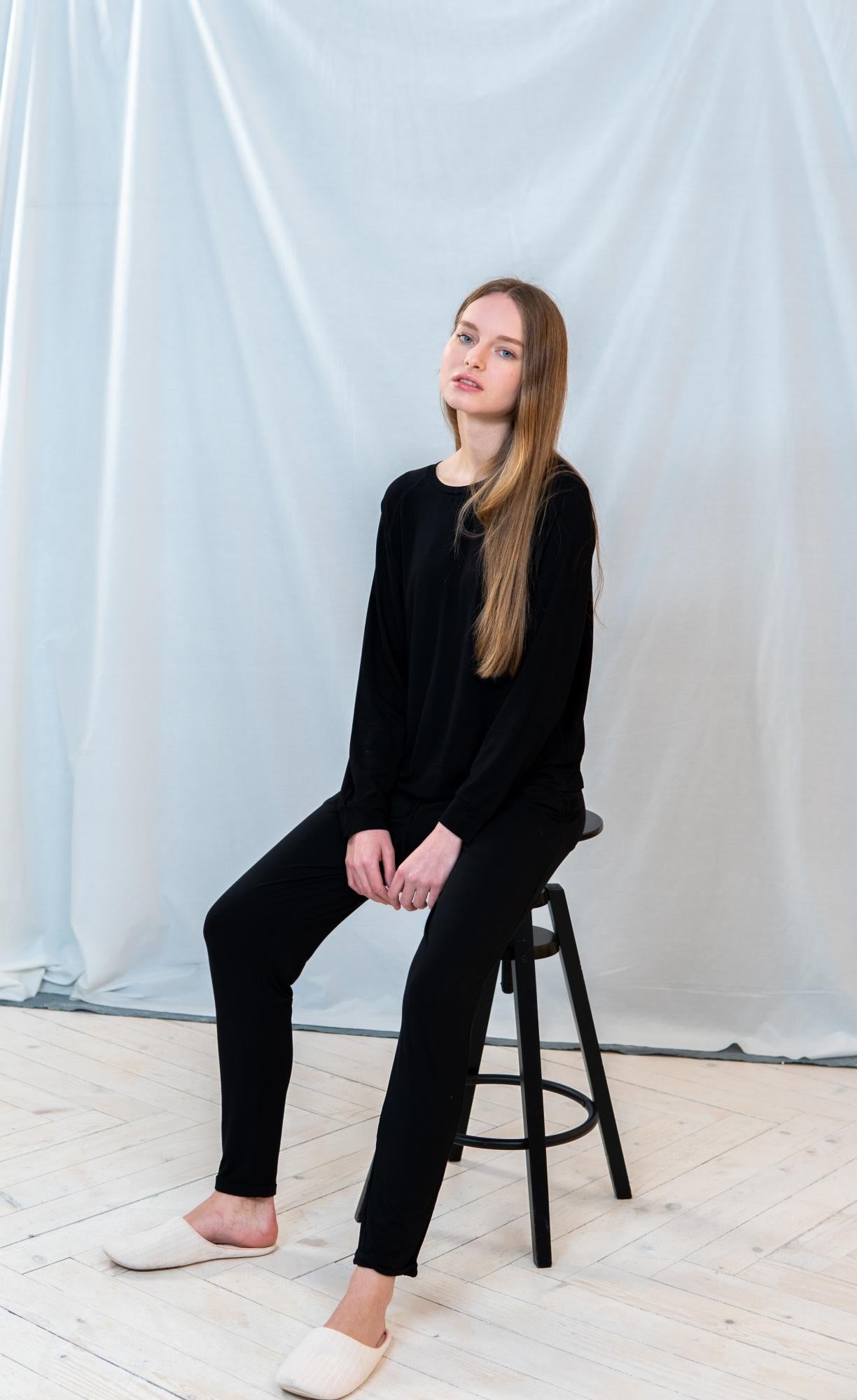 Model wearing Black lounge long set with raglan long-sleeve top and cuffed drawstring pants