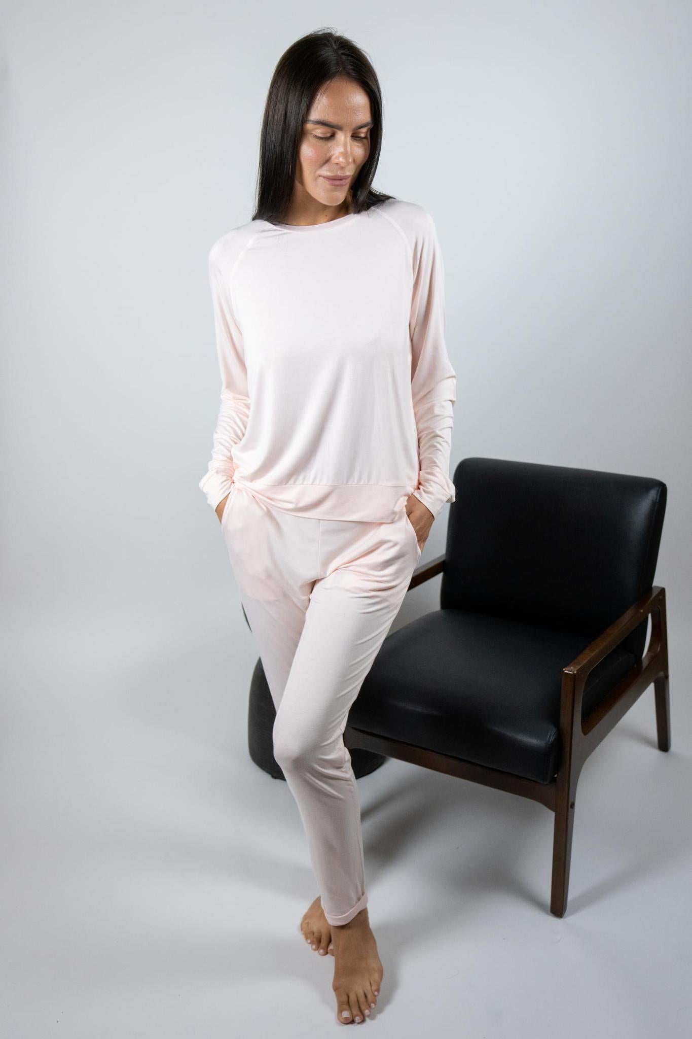 Model wearing rosewater bamboo lounge set with long sleeve top and drawstring pants