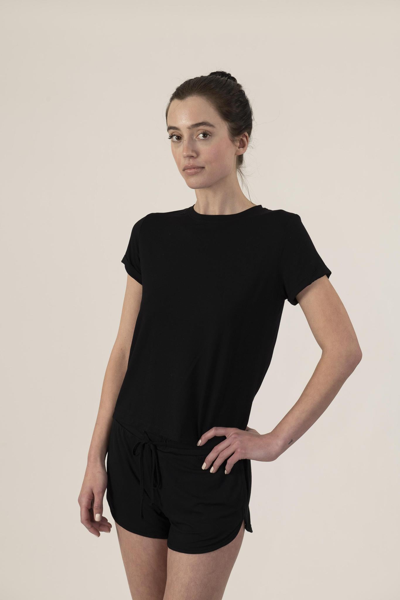 Model wearing Black lounge short set with rolled sleeve top and drawstring shorts