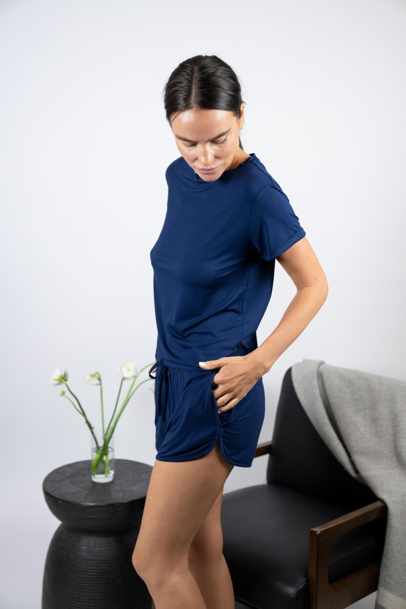 Model wearing Navy lounge short set with rolled sleeve top and drawstring shorts