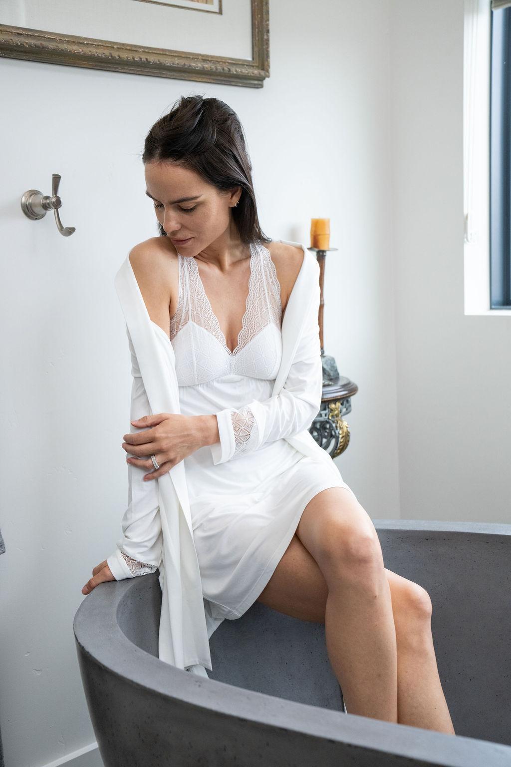 Model wearing Nora Racerback Chemise in Ivory with lace detail and smooth bamboo fabric