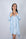Model wearing Nora Short Robe in Ice Melt blue with lace detail and sewn-in belt