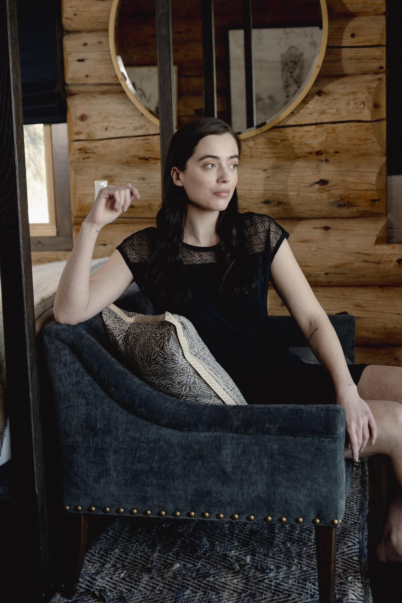 Model wearing Nora T-Shirt Dress in black with lace panel detailing and relaxed silhouette