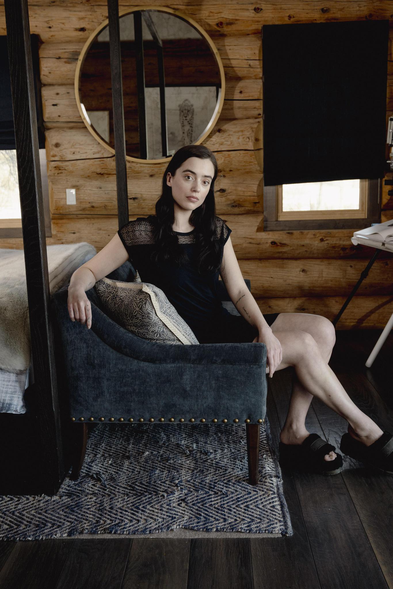 Model wearing Nora T-Shirt Dress in black with lace panel detailing and relaxed silhouette