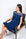 Model wearing the Nora T-Shirt Dress in Navy with lace panels and relaxed silhouette