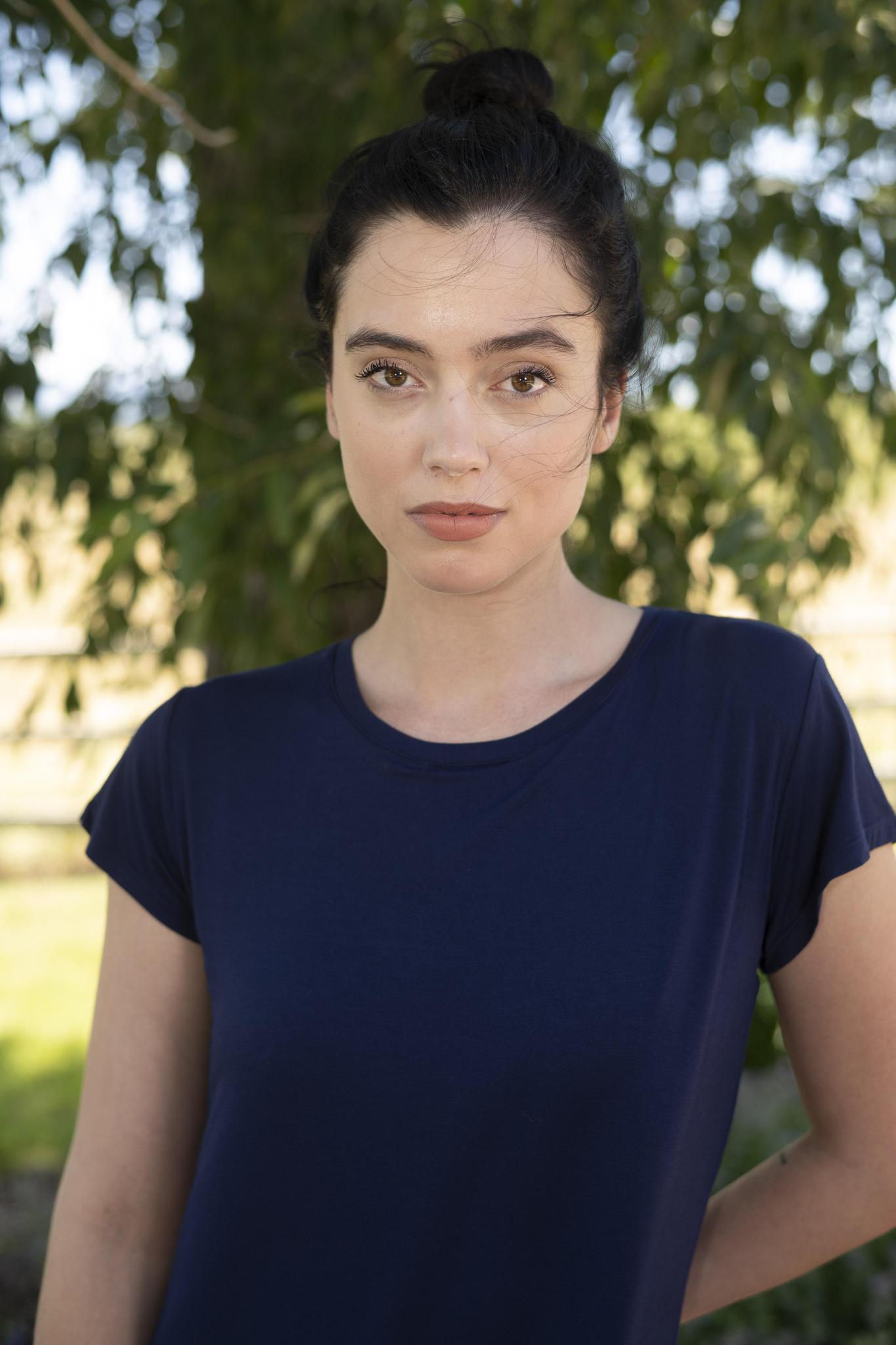 Model wearing navy Restless Lounger Dress with built-in shelf bra and relaxed bamboo silhouette