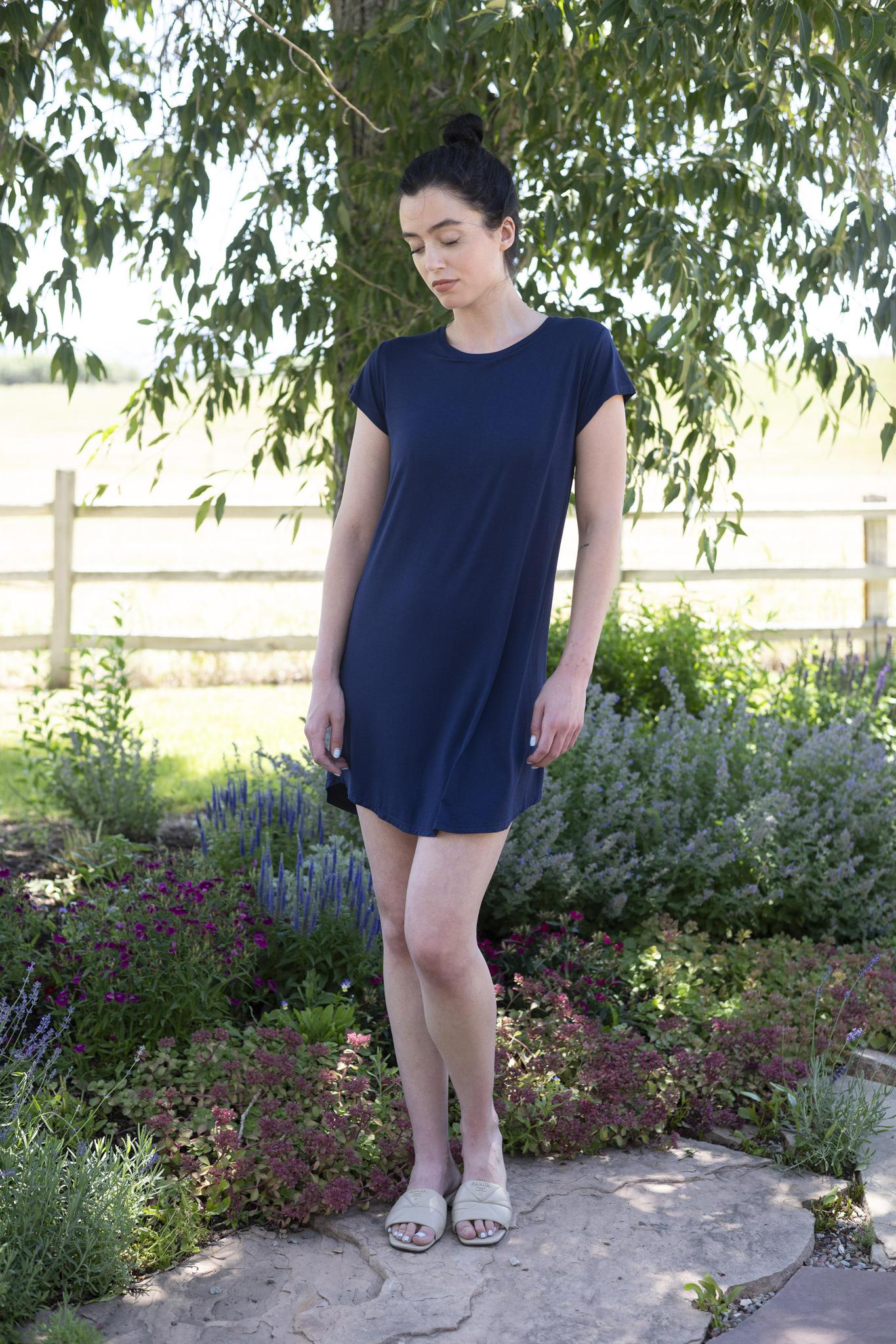 Model wearing navy Restless Lounger Dress with built-in shelf bra and relaxed bamboo silhouette