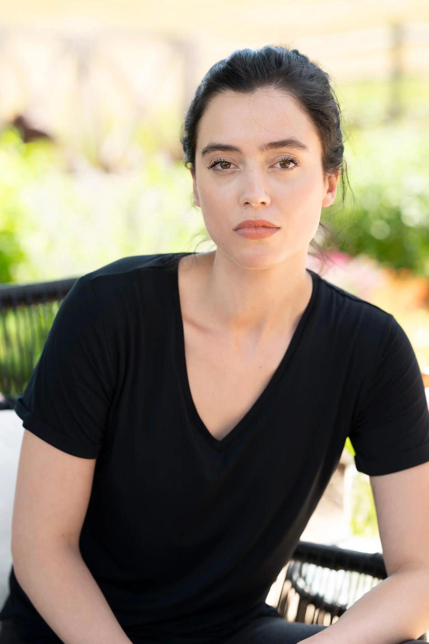 Model wearing the Restless Lounger T-Shirt in Black, with built-in shelf bra and relaxed silhouette