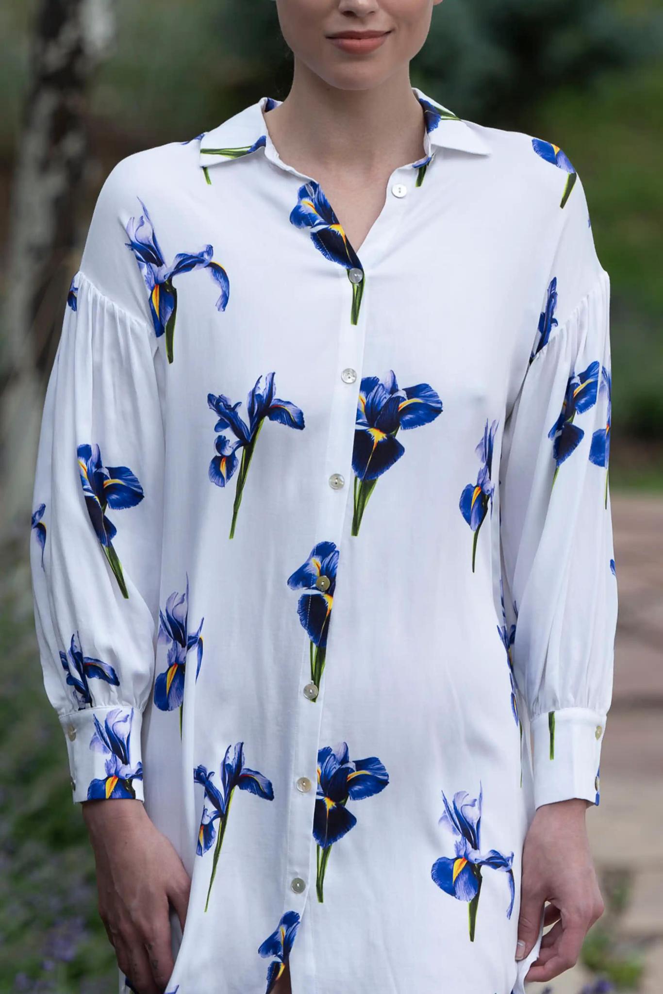 Model wearing silky satin dress with iris print, shirt collar, button-down front, and long gathered sleeves