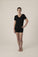 Model wearing black V-neck T-shirt with semi-fitted cut and short sleeves, with matching shorts