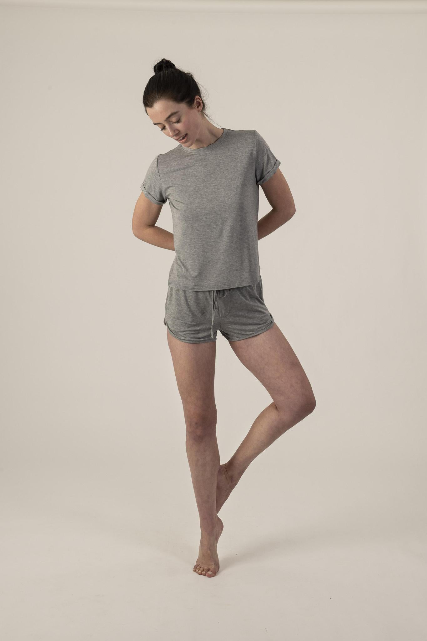 Model wearing Hang Out Track Shorts in Heather Gray with relaxed fit and drawstring waistband, with matching t-shirt