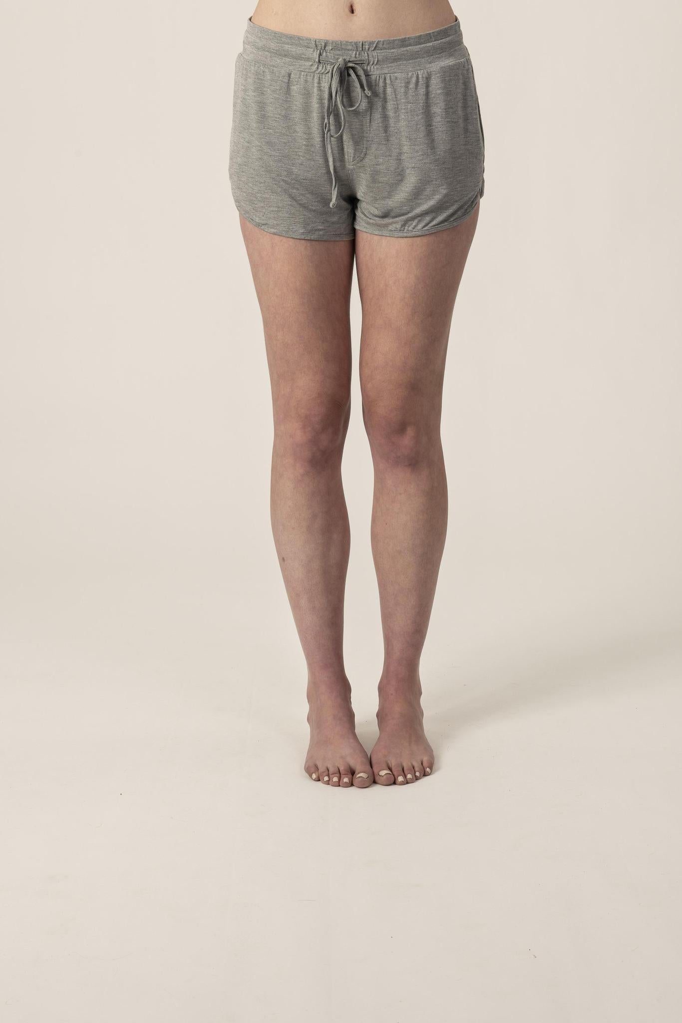 Model wearing Hang Out Track Shorts in Heather Gray with relaxed fit and drawstring waistband.
